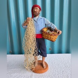 Vintage Handcrafted Fisherman Figurine with Red Hat and Blue Outfit Terra Cotta